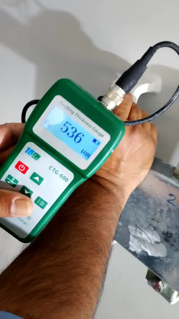 Checking dry film thickness inside tank using coating thickness gauge